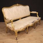 French golden sofa in Louis XV style from 20th century